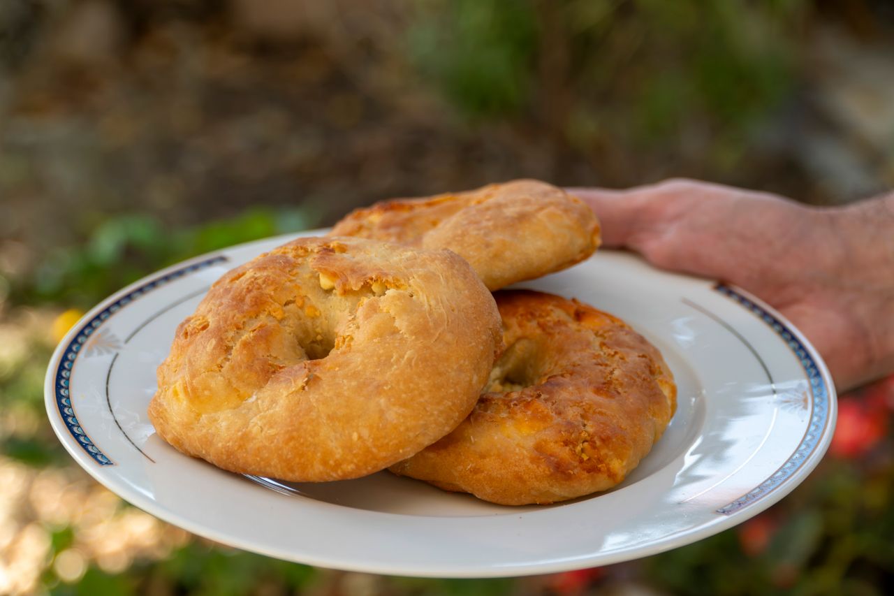 Traditional Greek tiganopsomo served on a plate, showcasing delicious homemade Greek fried bread.